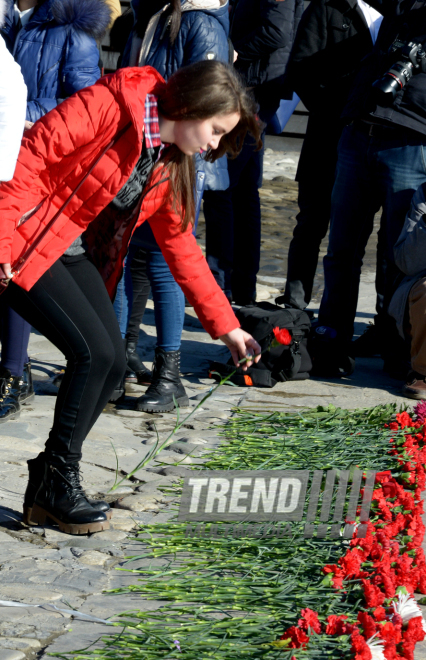 Baku residents bringing flowers to Seaside Boulevard to honor missing oil workers.  Azerbaijan, Dec.07, 2015